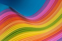 a close up of a rainbow colored paper